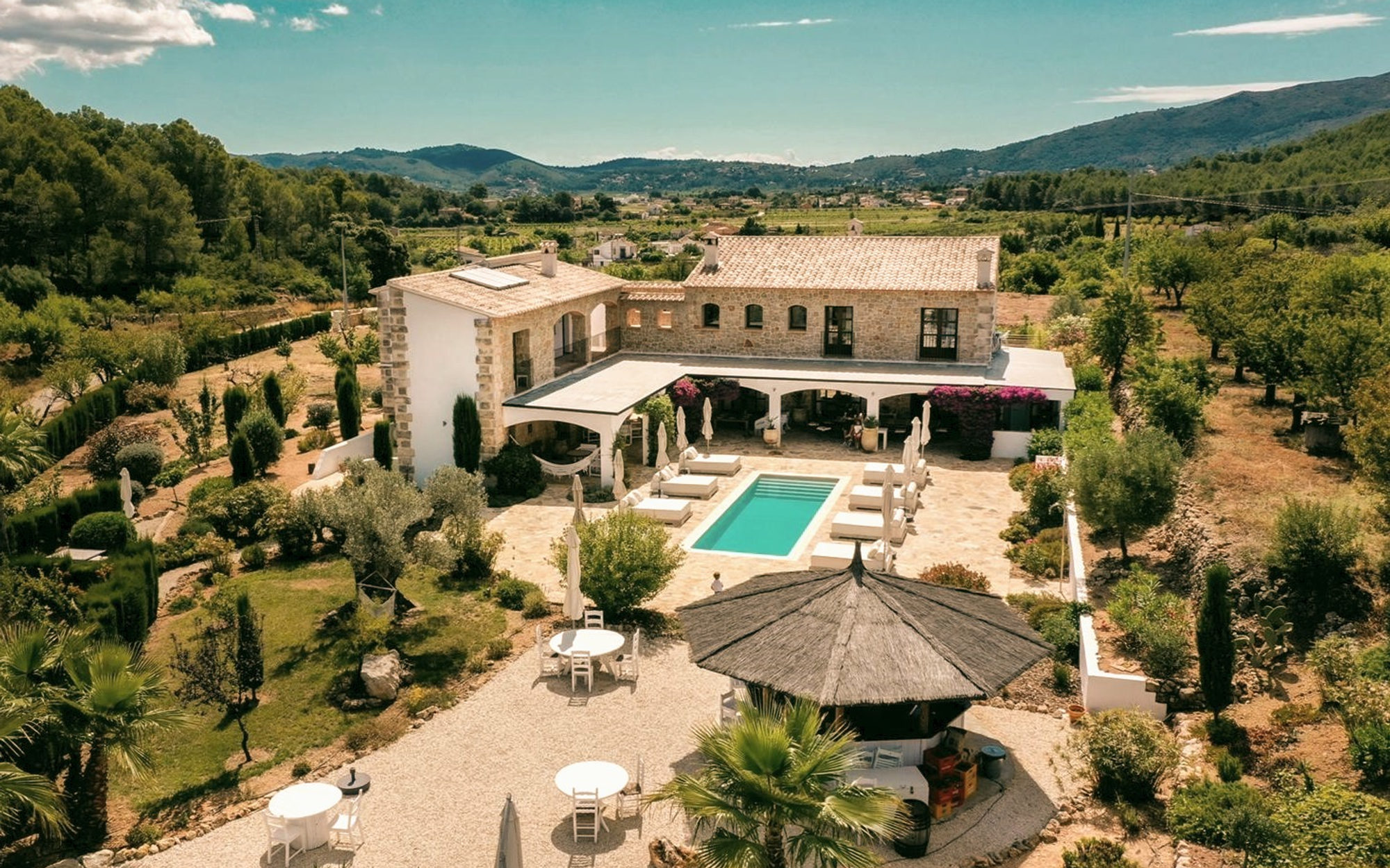 Aerial view of Cuatre Finques, a stone finca among olive groves in the Xaló Valley