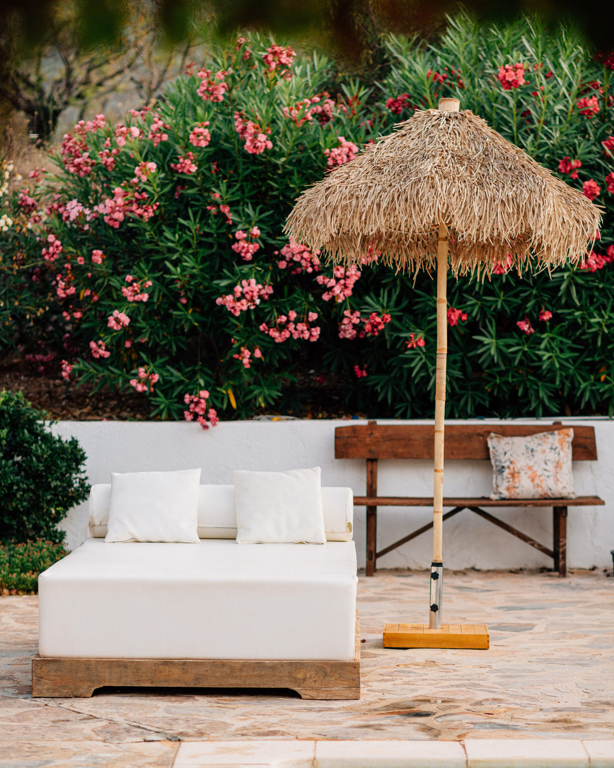 Quiet daybed corner with soft textiles at Cuatre Finques